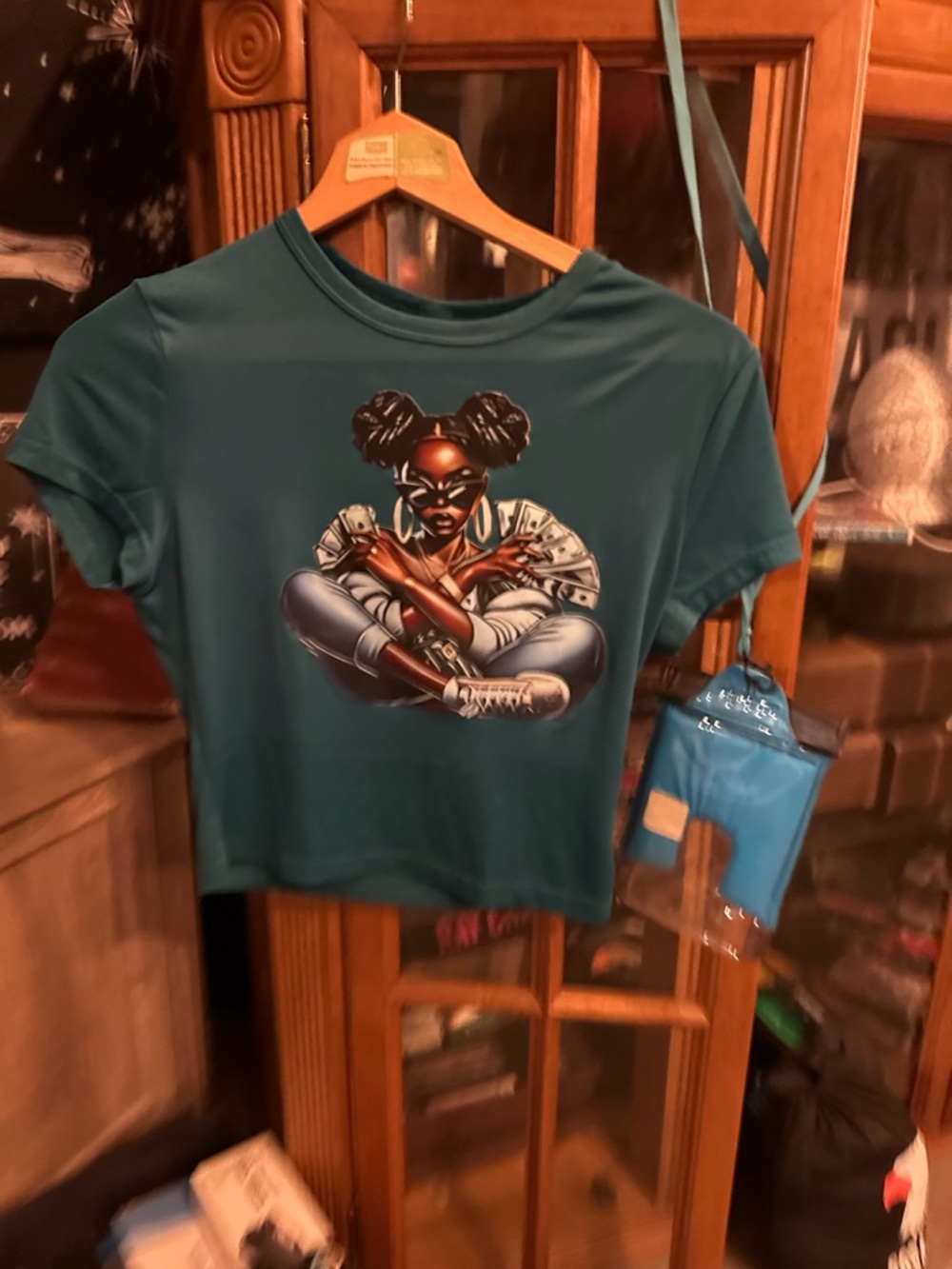Graphic Teal Cropped Tee with Bold Afrocentric Illustration